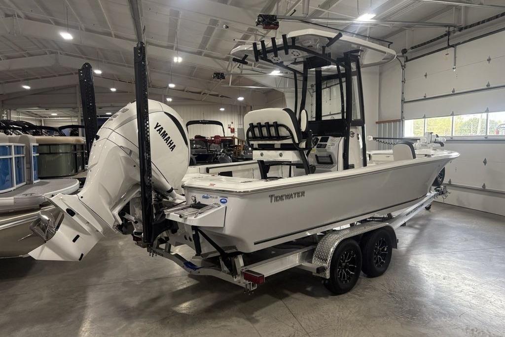 2026 Tidewater 2300 Carolina Bay boat with Yamaha engine in a showroom.