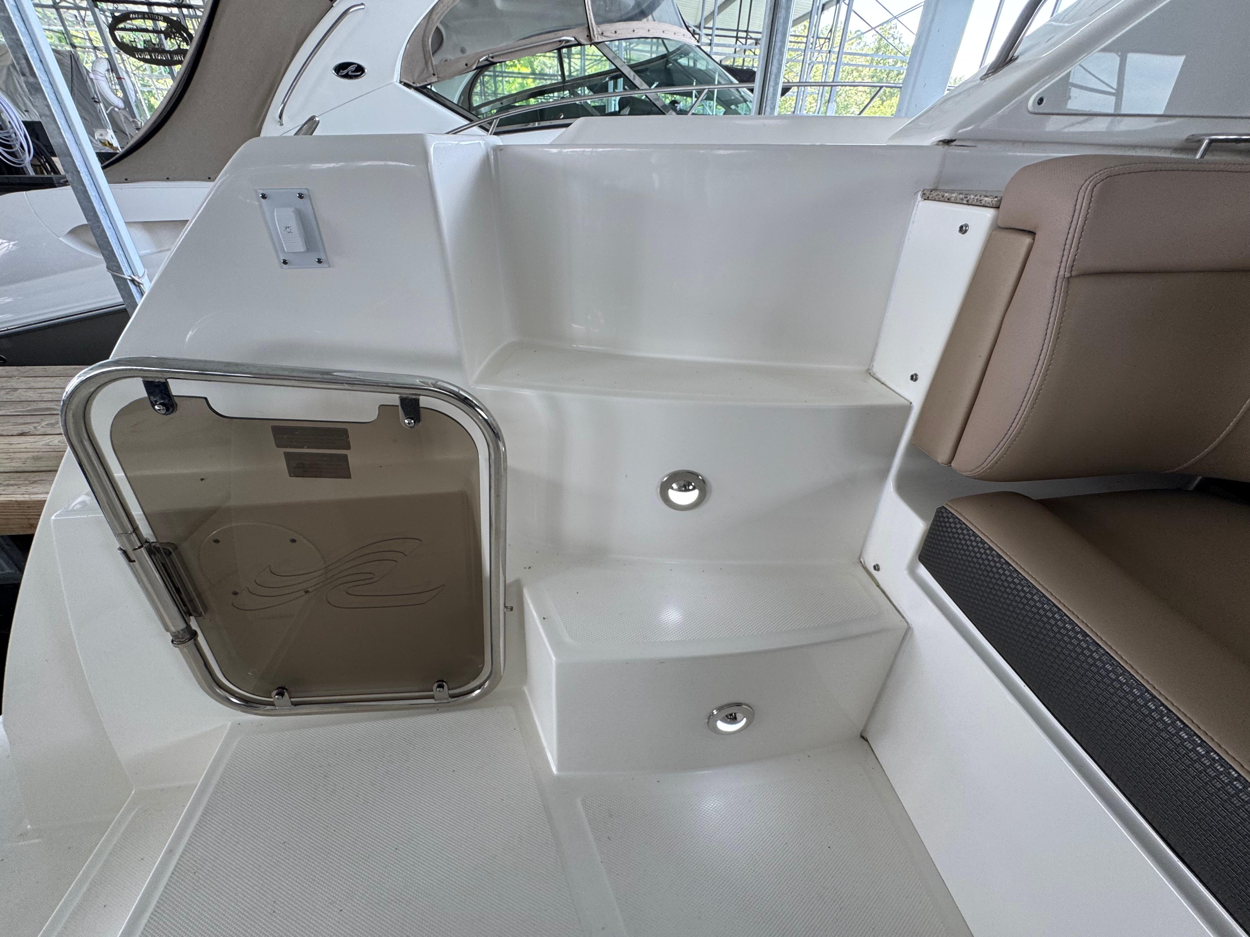 2017 Sea Ray Sundancer 400 interior steps with seating and hatch door.