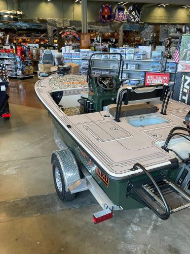 2025 Mako 18 Pro Skiff Backwater Edition displayed in a showroom.