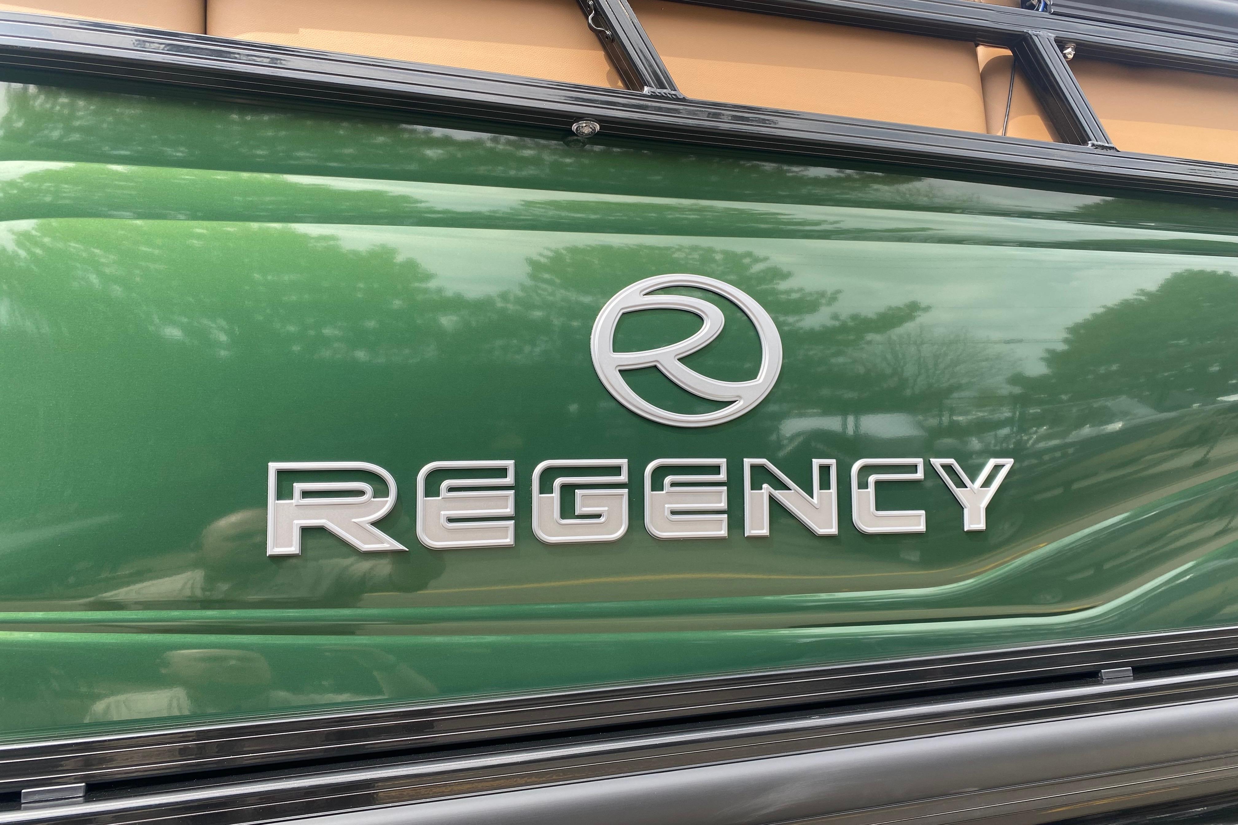2026 Regency 230 DL logo on a sleek green surface.