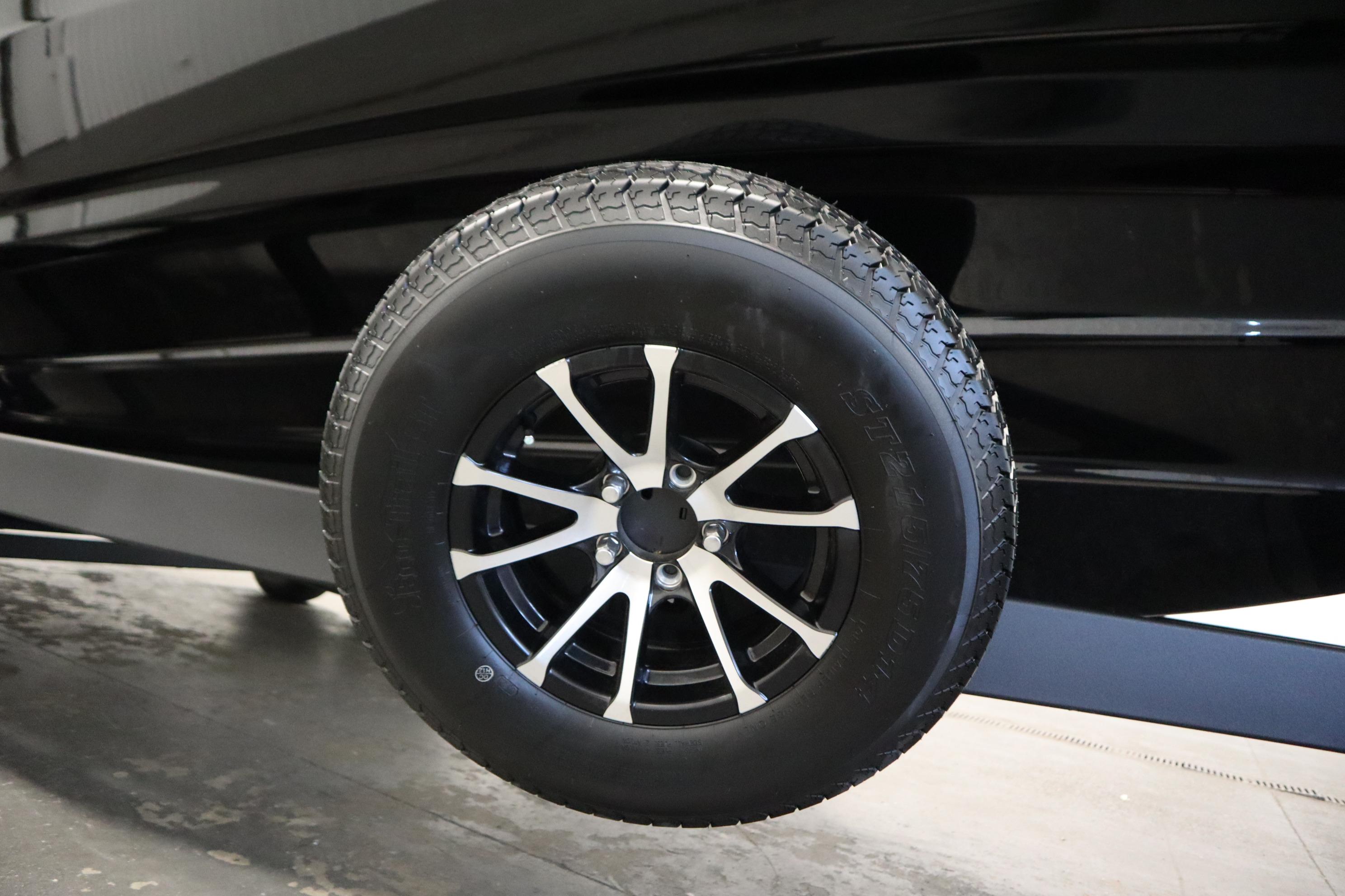 2026 Yamaha Boats AR250 trailer wheel with sleek black and silver design.