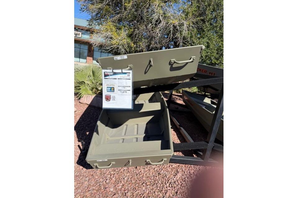 2026 Tracker Grizzly 12 Jon boat displayed outdoors on a stand.