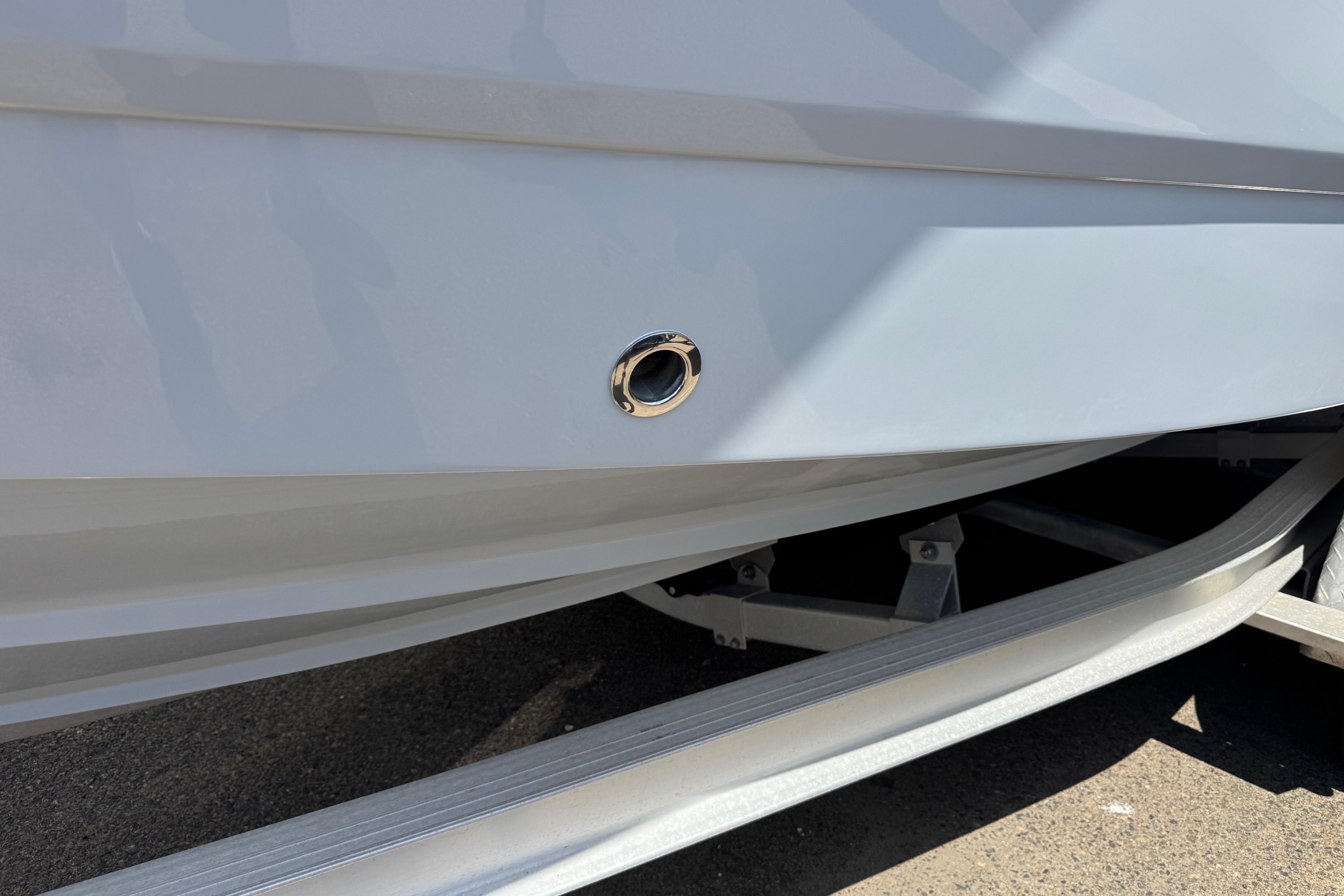 2022 Robalo R230 Center Console boat hull on trailer, close-up view.
