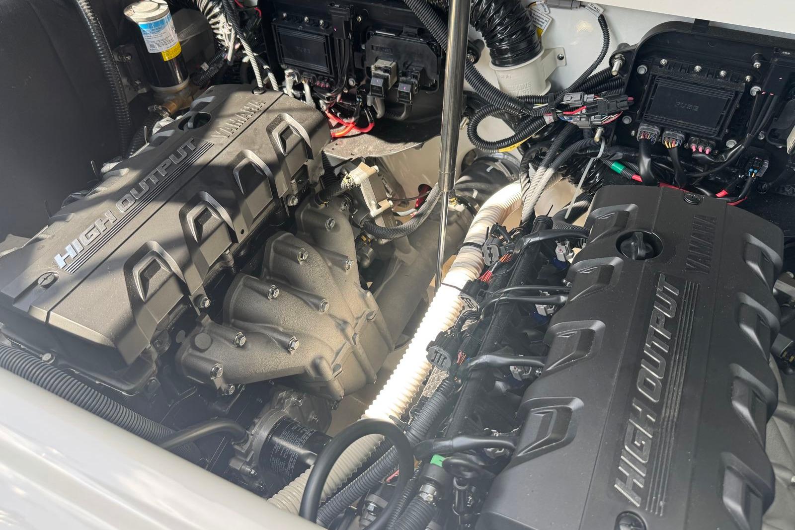 2023 Yamaha Boats 252XE engine compartment showcasing high-output engines and advanced wiring.