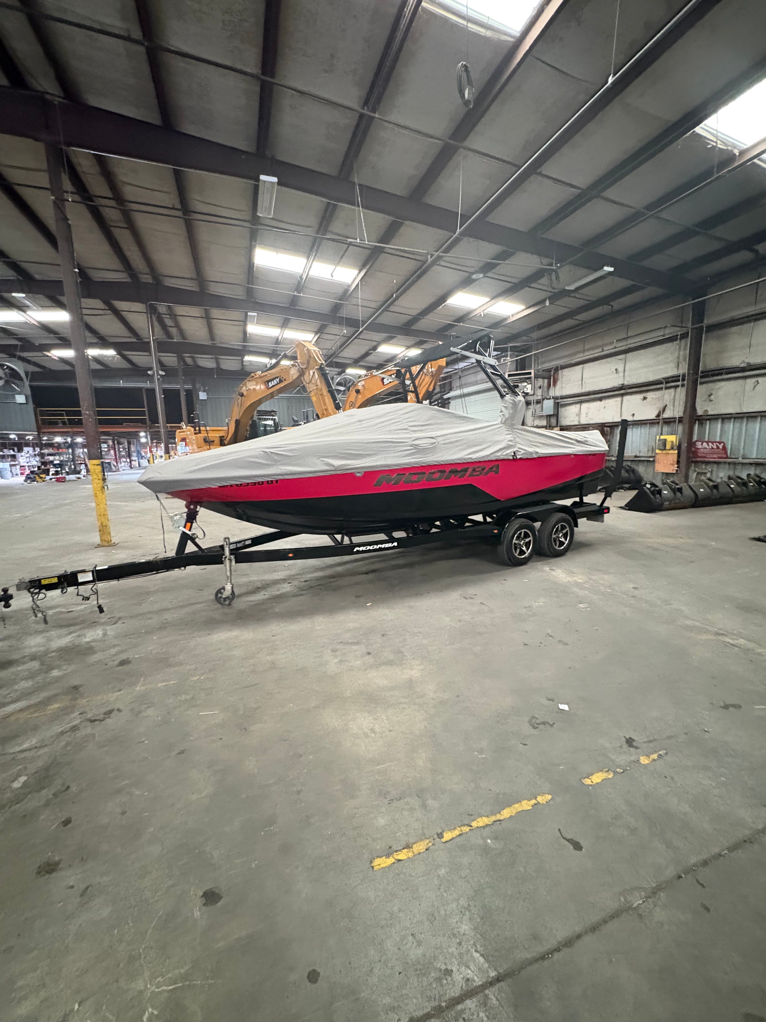 2019 Moomba Craz boat on trailer in warehouse.