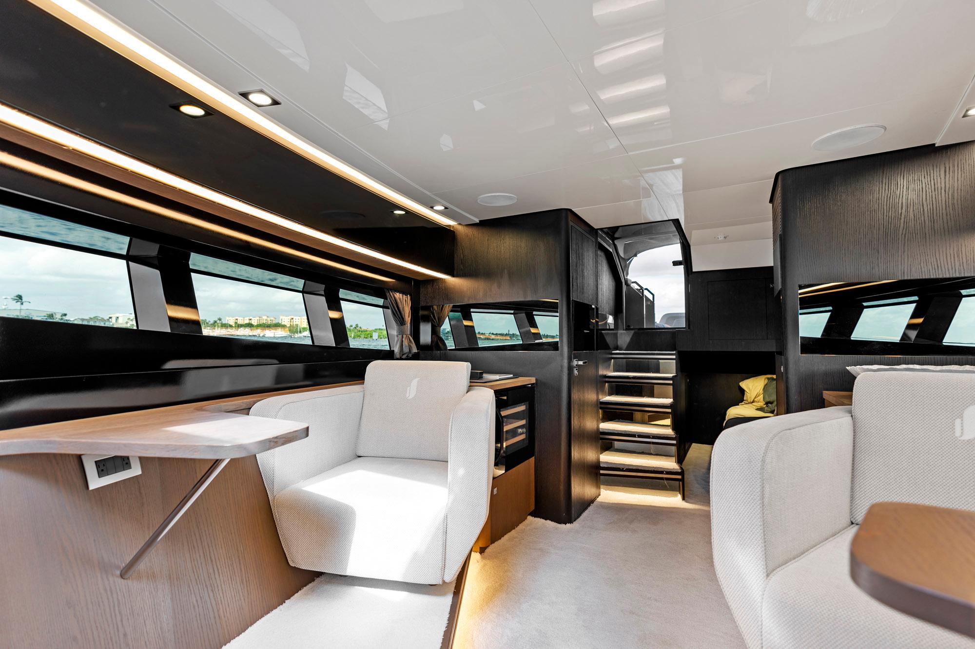 Luxurious interior of 2021 Sichterman Libertas 54 yacht with modern seating and sleek design.