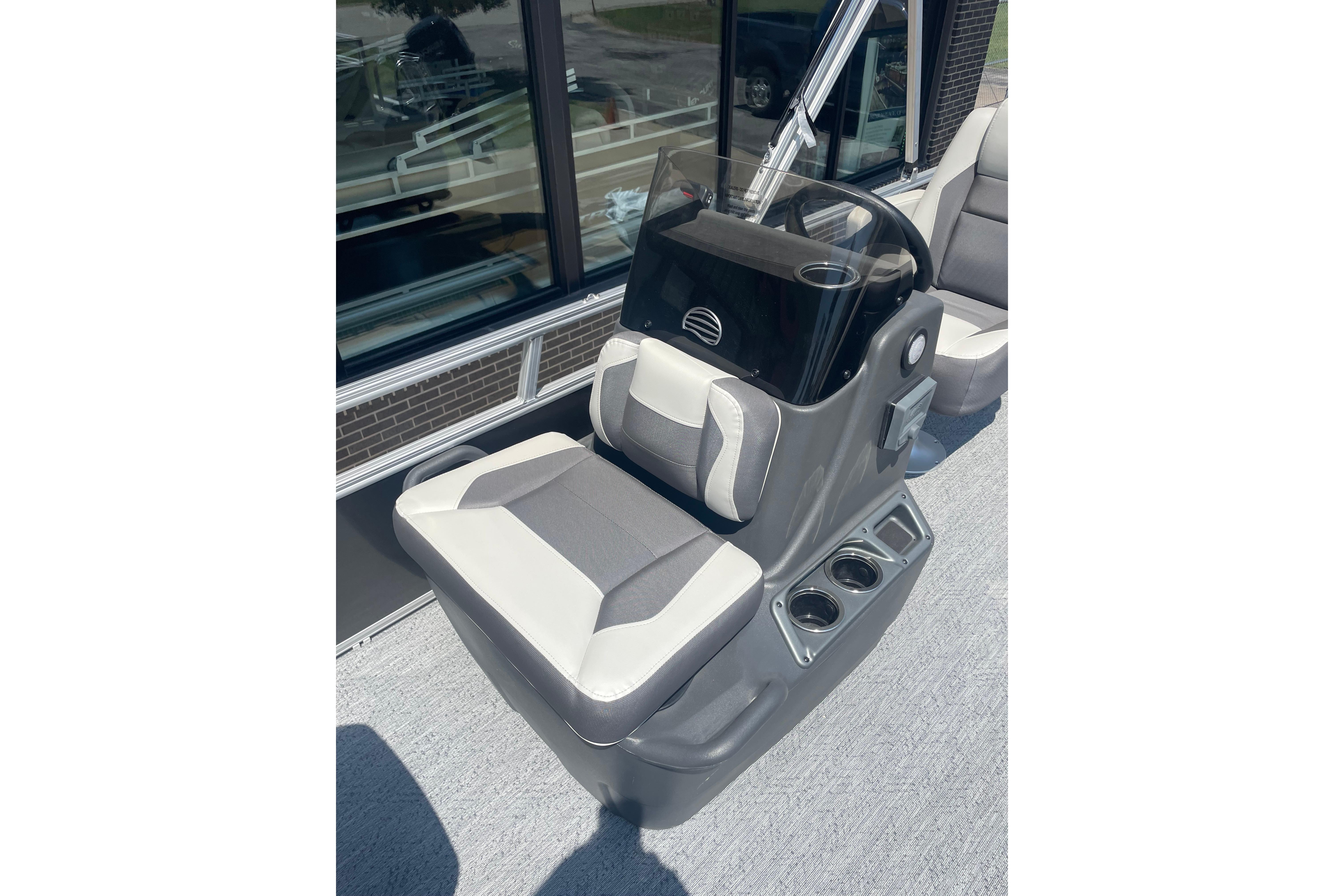 2026 Sun Tracker Bass Buggy 16 XL Select helm with cushioned seat and cup holders.