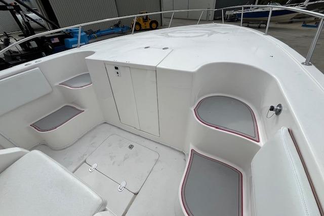 2001 Fountain 38 Center Console boat interior with white seating and storage compartments.