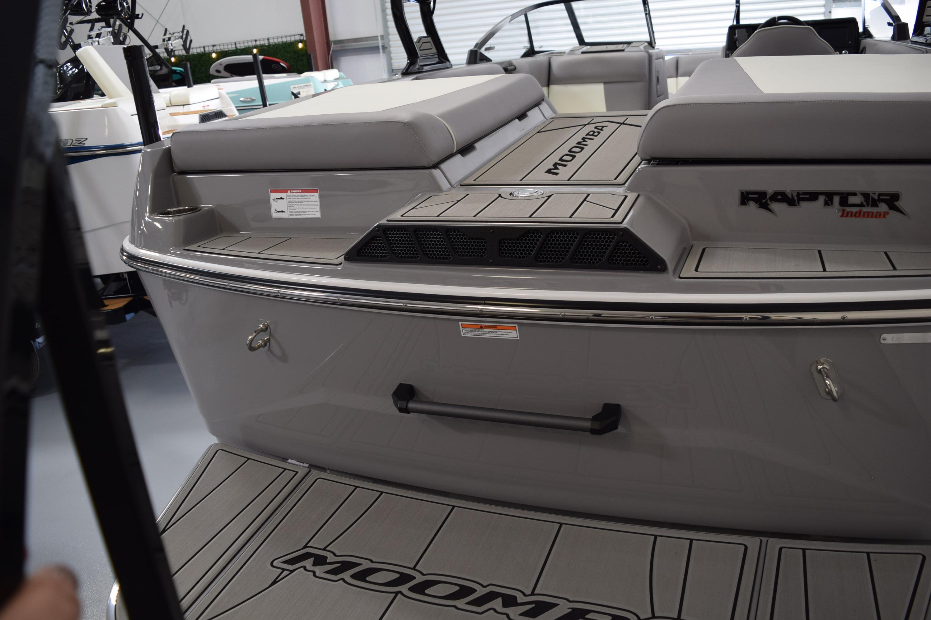 2026 Moomba Craz boat with Raptor Indmar engine, featuring sleek gray design and spacious seating.