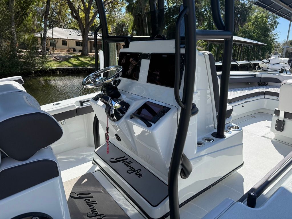 The image shows the cockpit of a 2020 Yellowfin 26 Hybrid boat with modern features.