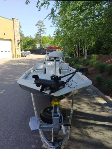 2024 Ranger RB210 boat on a trailer in a parking lot.