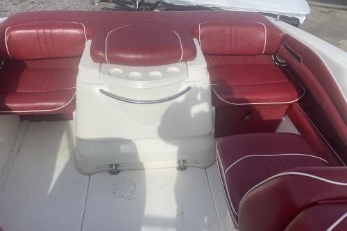 1997 Sea Ray 230 Overnighter boat interior with red and white seating arrangement.