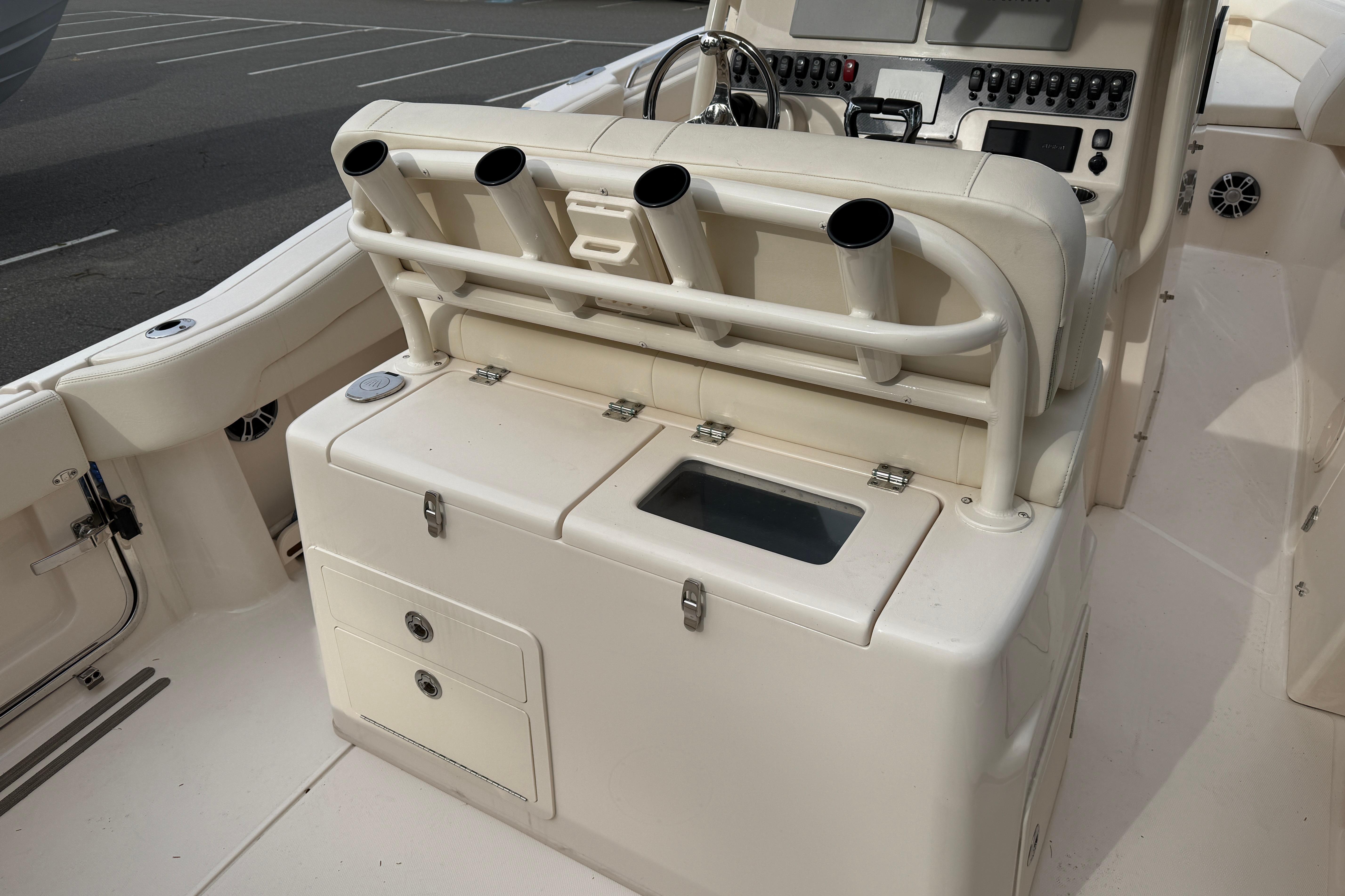2024 Grady-White Canyon 271 boat interior with rod holders and control panel.
