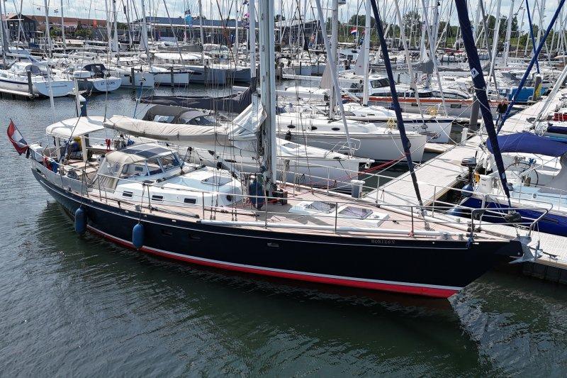 Sailing yacht Koopmans 50, 1990 model, docked in a marina with other boats.