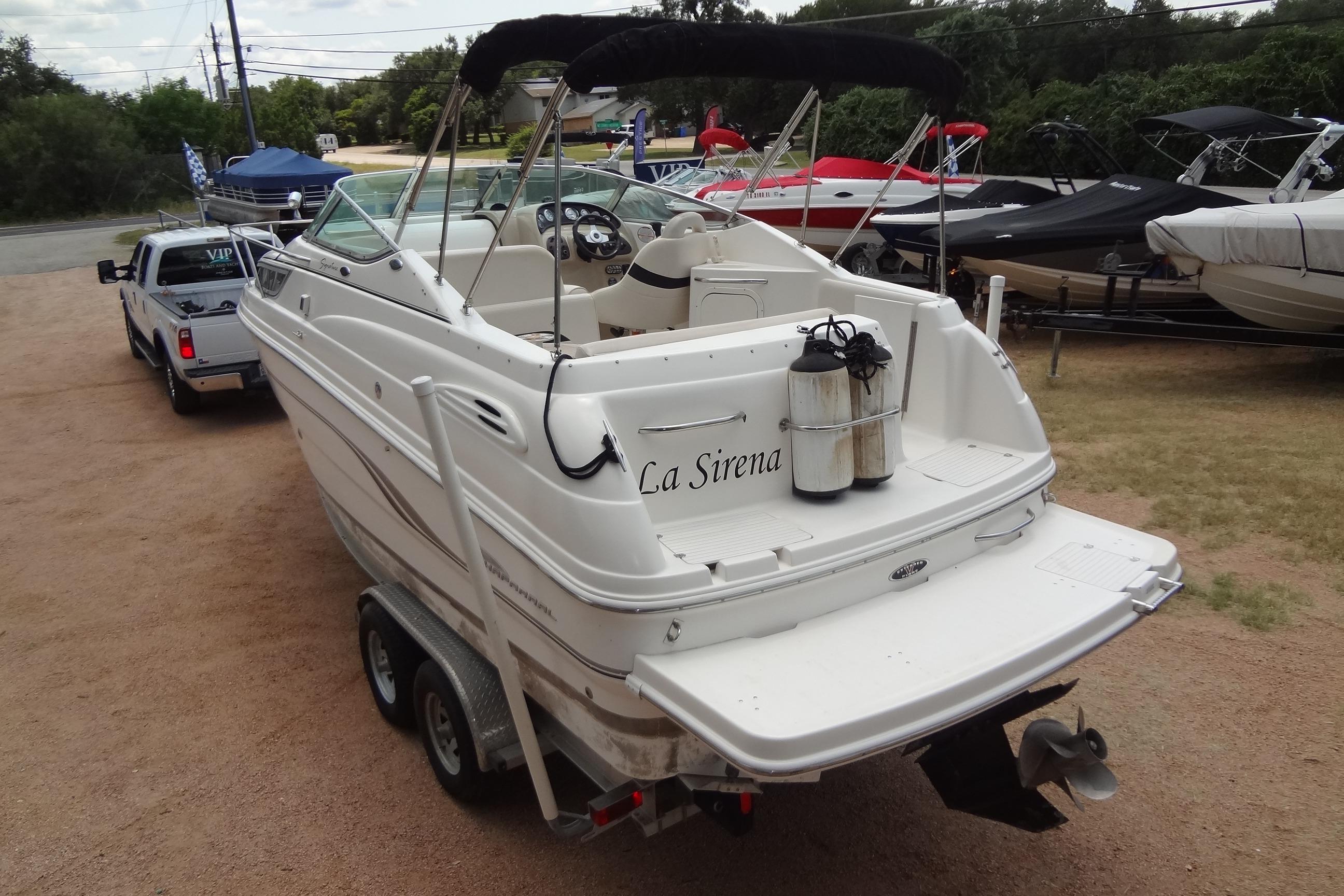 2000 Chaparral Signature 260 boat on trailer, rear view, named "La Sirena".