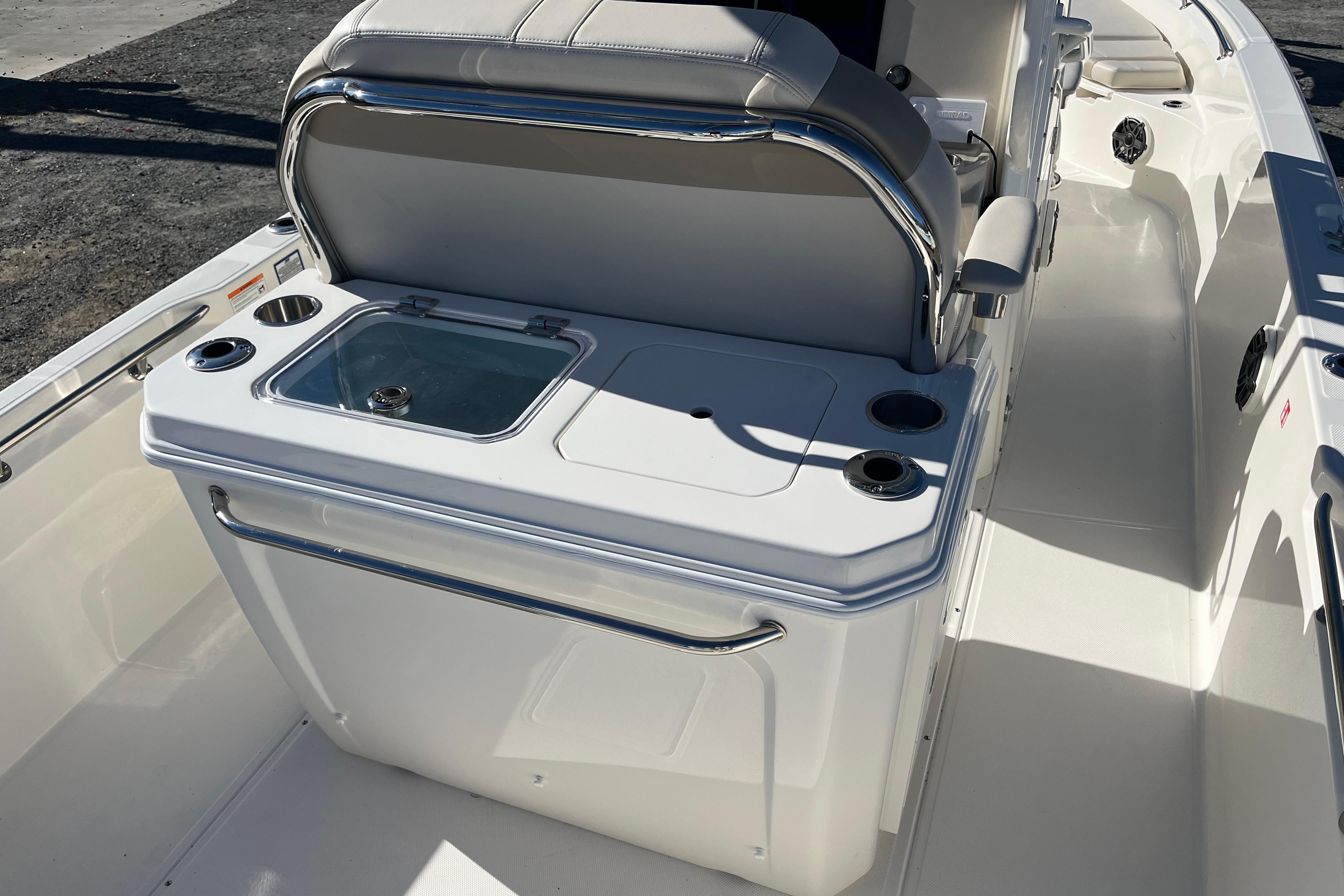 2026 Boston Whaler 280 Dauntless boat interior with seating and storage area.