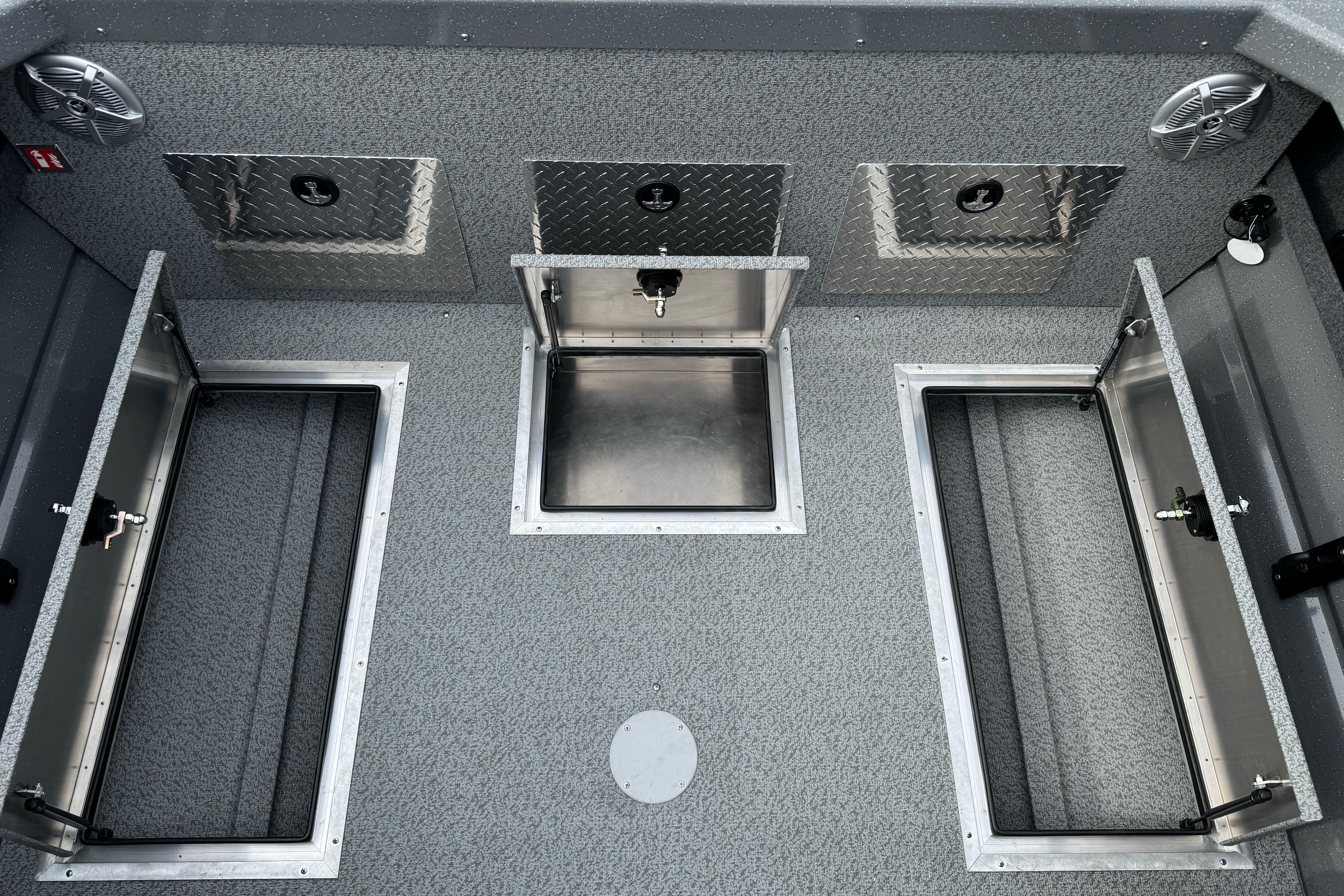 2026 Lund 185 Heavy Gauge boat interior with storage compartments and diamond plate accents.
