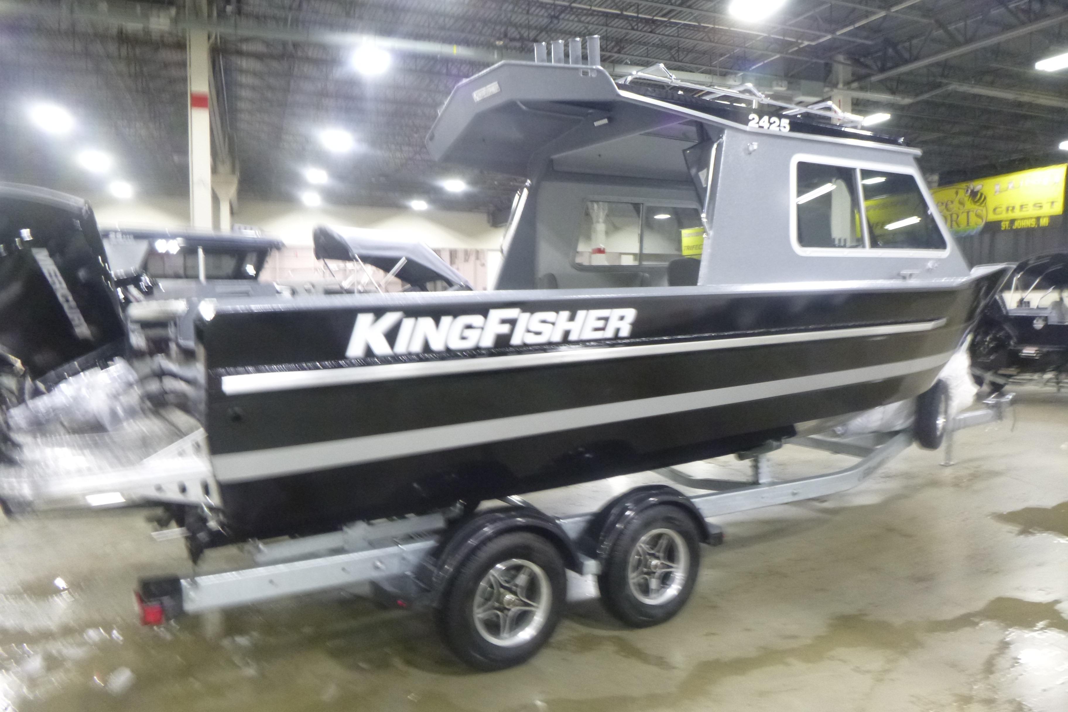 2026 KingFisher 2425 Escape HT boat on trailer in indoor showroom.