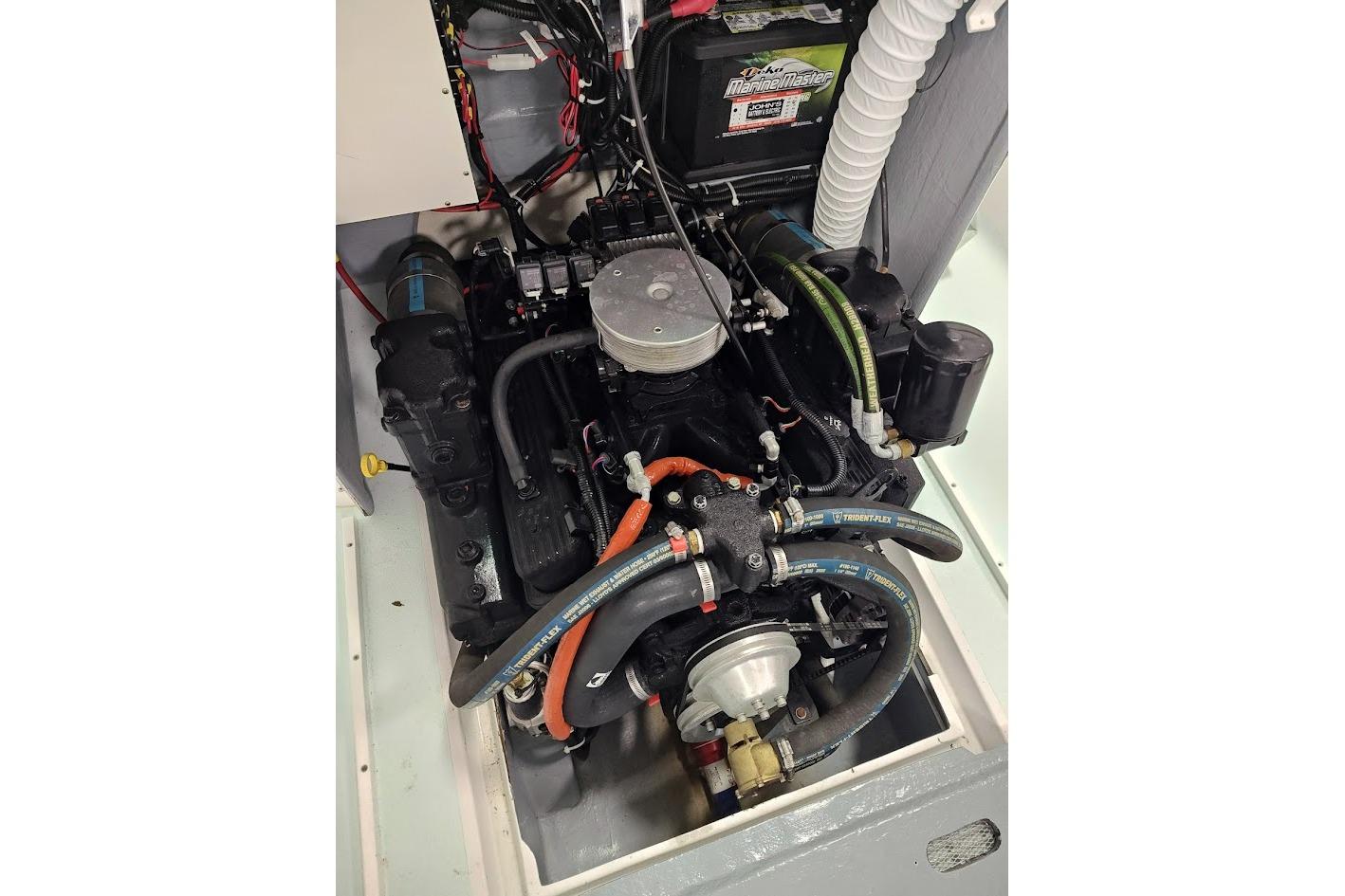 Engine compartment of a 1975 Shamrock 200 Open boat, featuring detailed wiring and components.