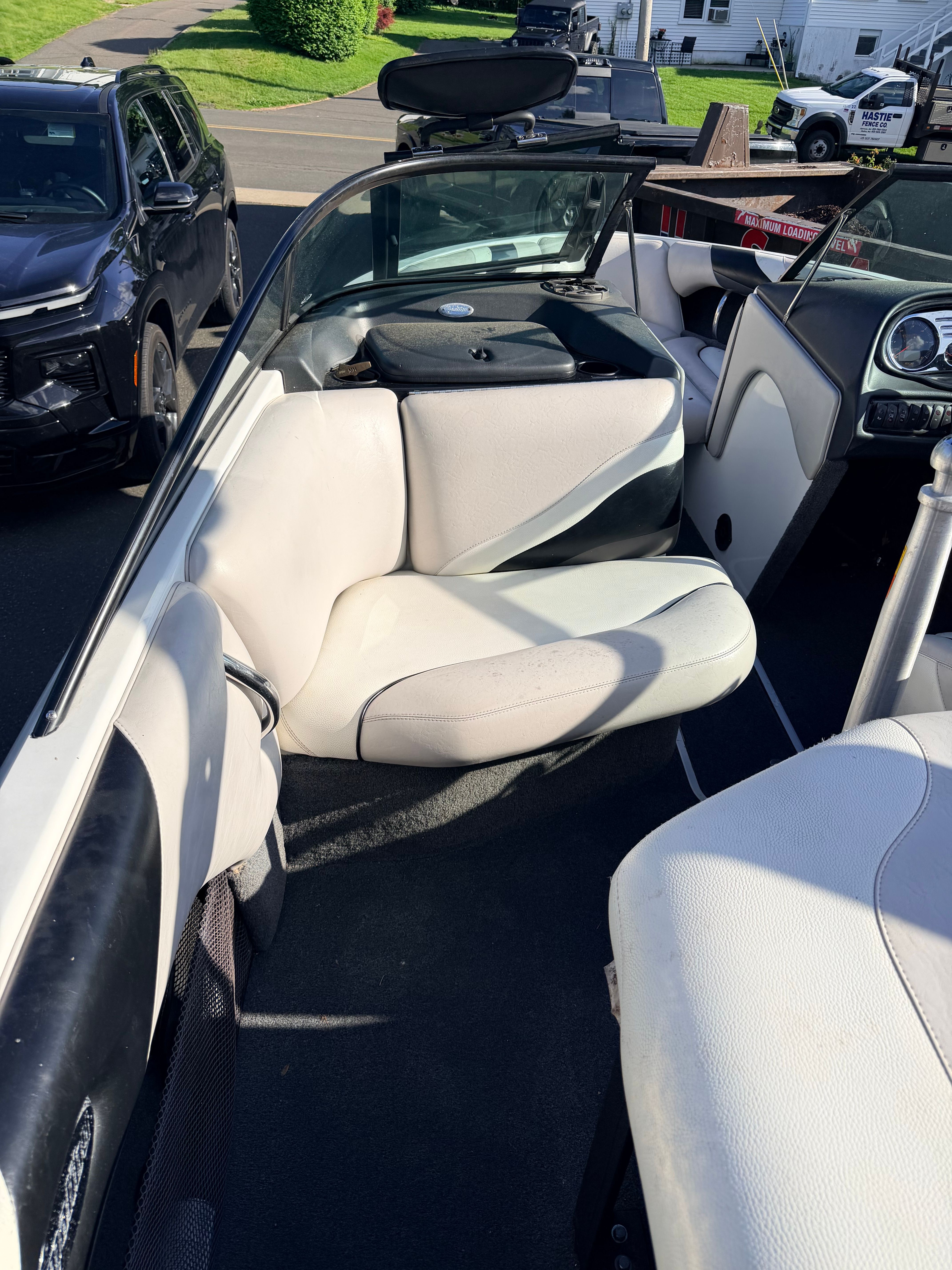 Interior of a 2006 Malibu iRide boat with white seating.