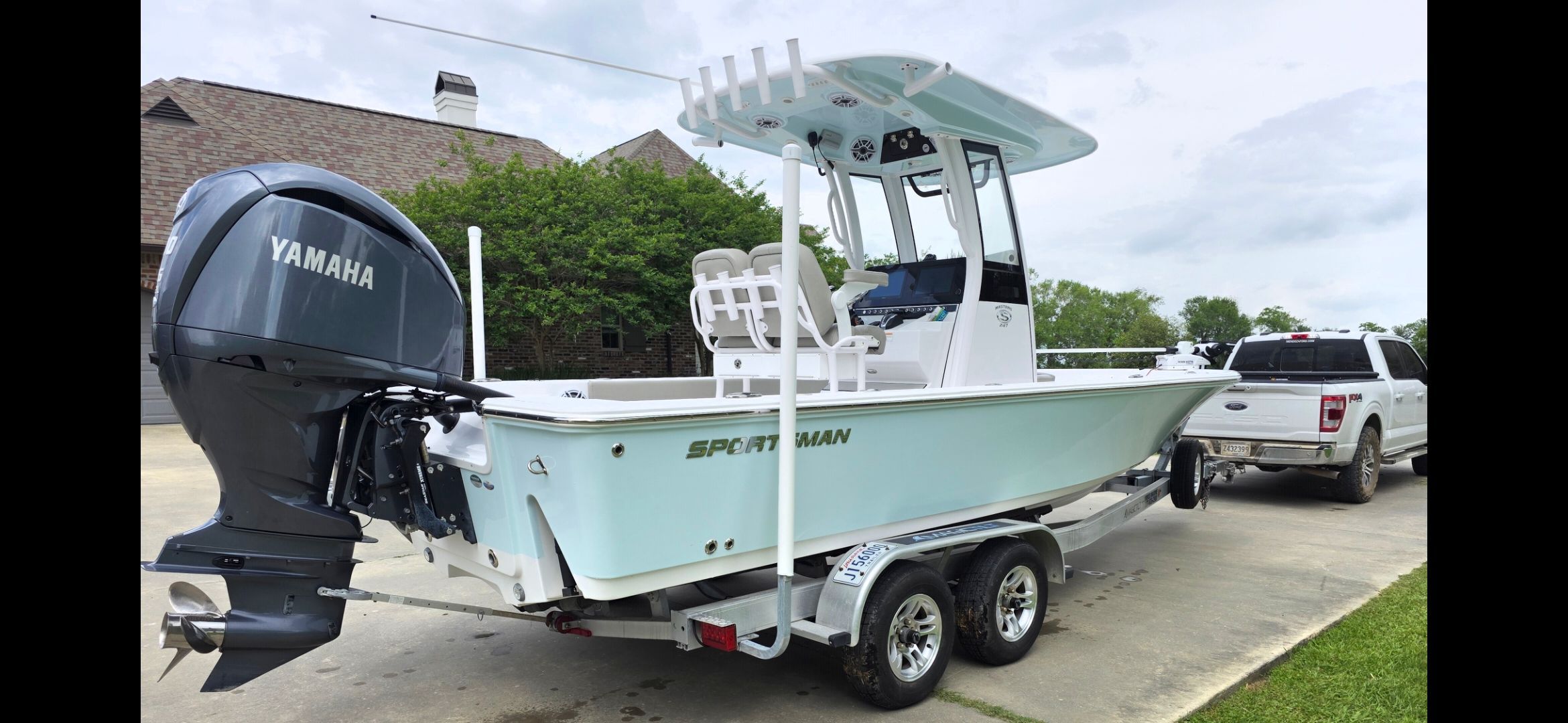 2023 Sportsman Masters 247 Bay Boat on trailer with Yamaha engine.