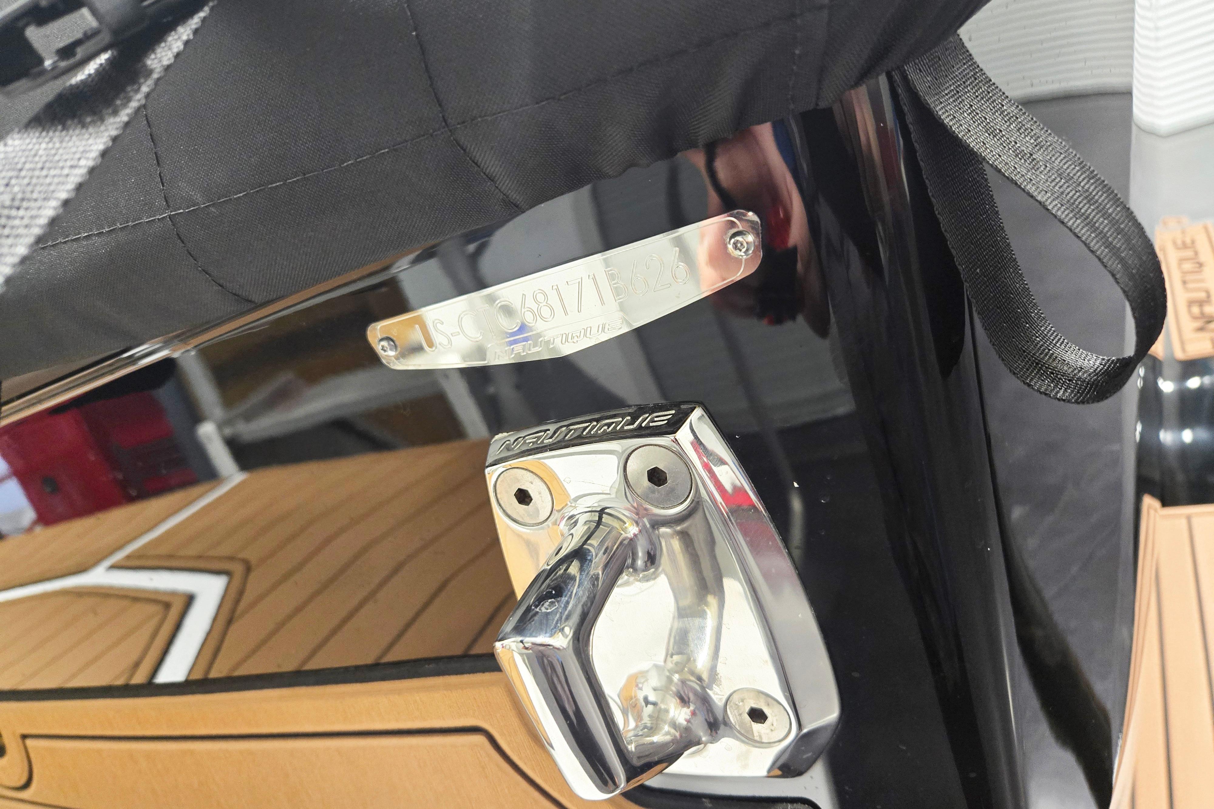 2026 Nautique Super Air Nautique GS22 boat detail with metal plate and handle.