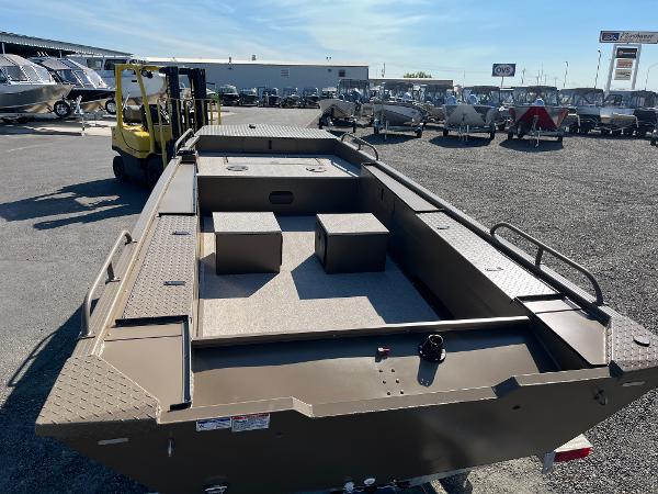 2024 Smoker Craft 1660 Sportsman Pro boat on display at a dealership.