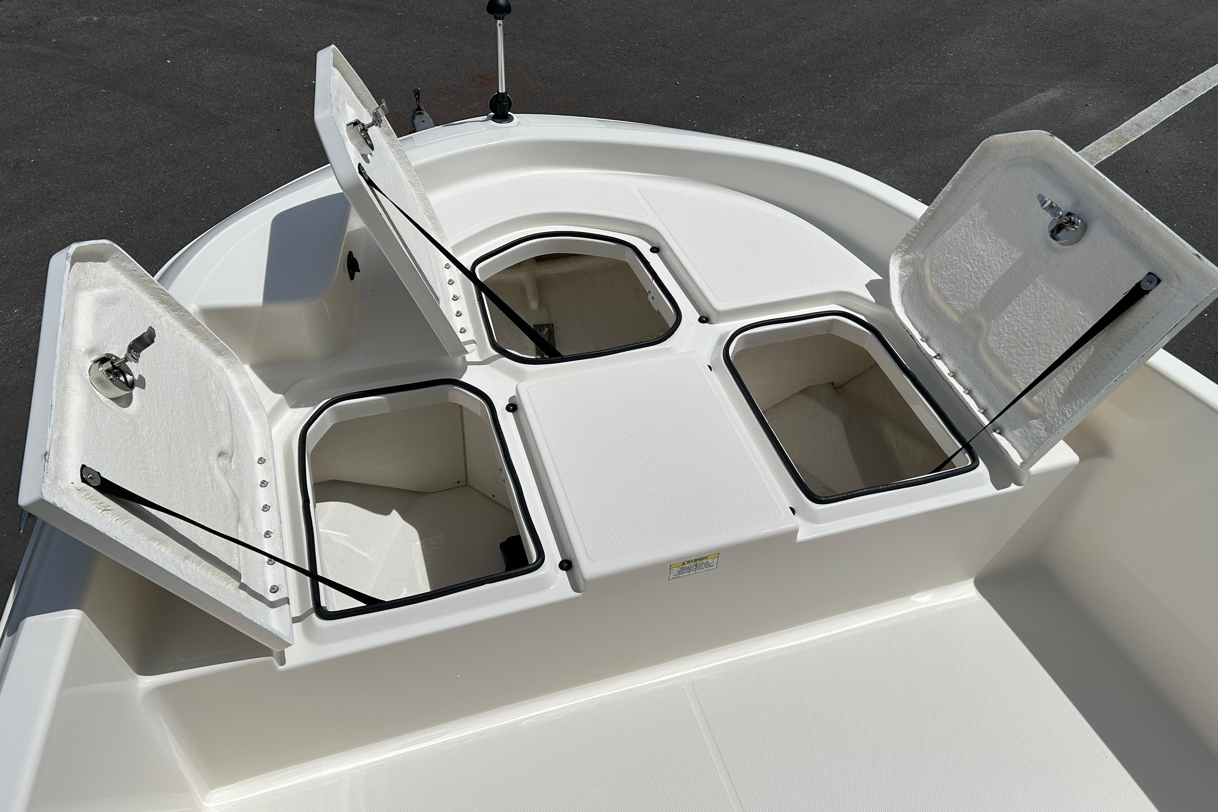 2018 Bayliner Element F16 boat storage compartments open on deck.