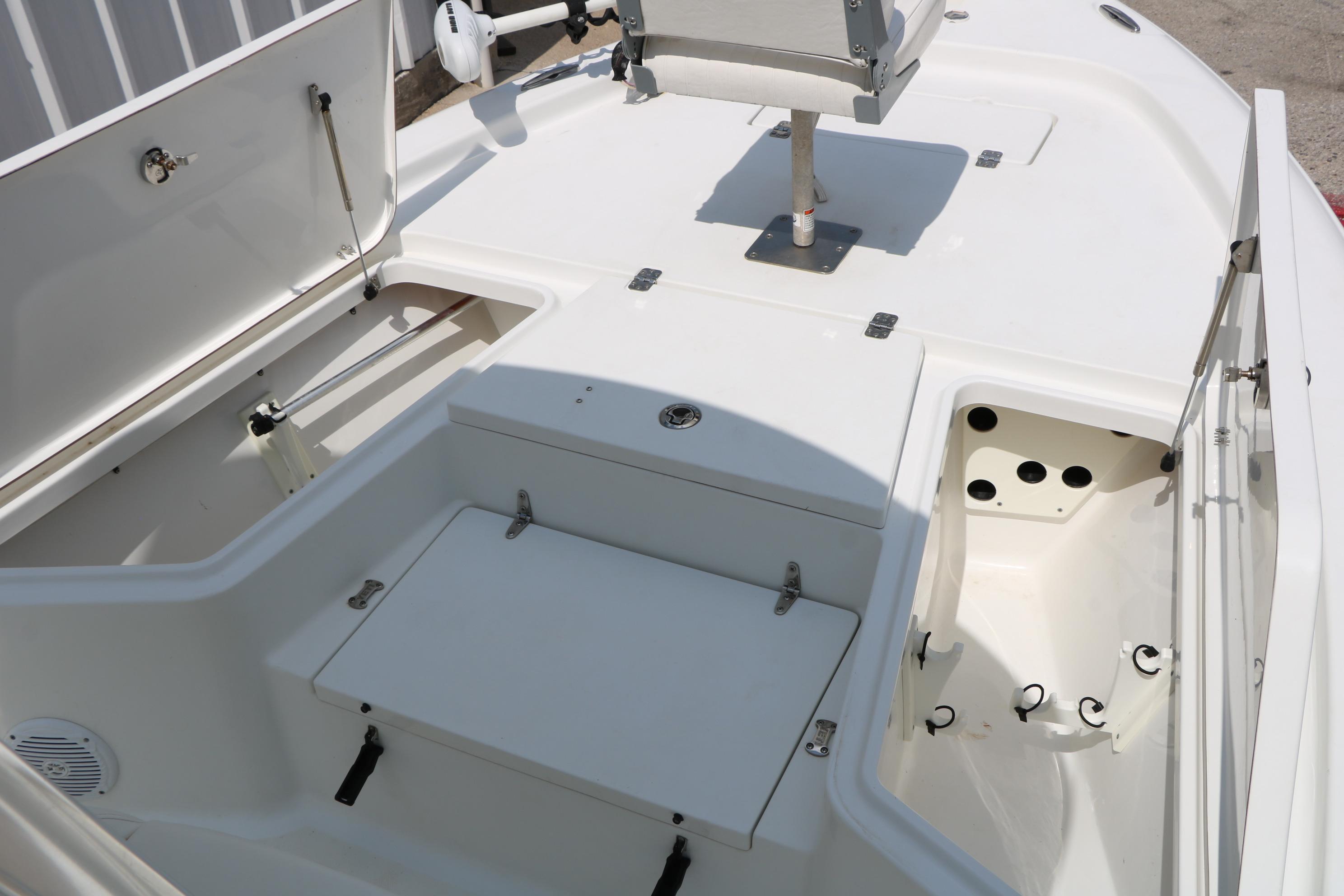2015 Sea Hunt BX 22 BR boat interior with storage compartments and seating area.