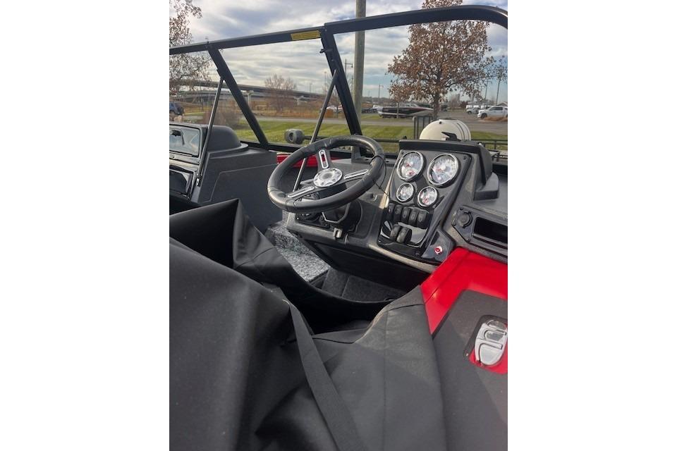 2026 Tracker Targa V-18 WT boat interior with steering wheel and dashboard controls.