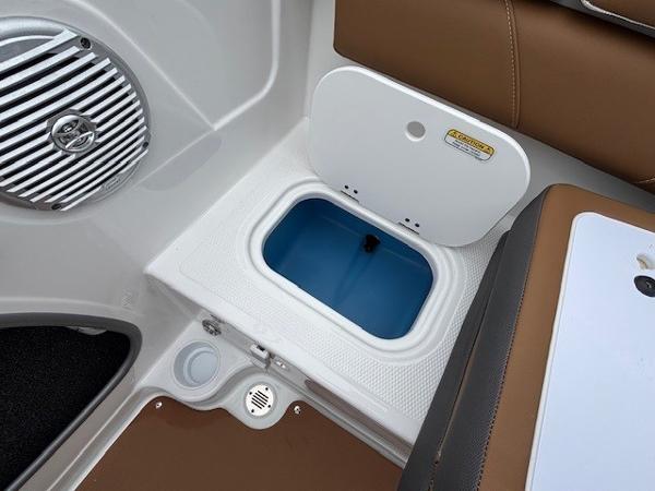 2025 Tahoe 185 S boat interior with open storage compartment and speaker.