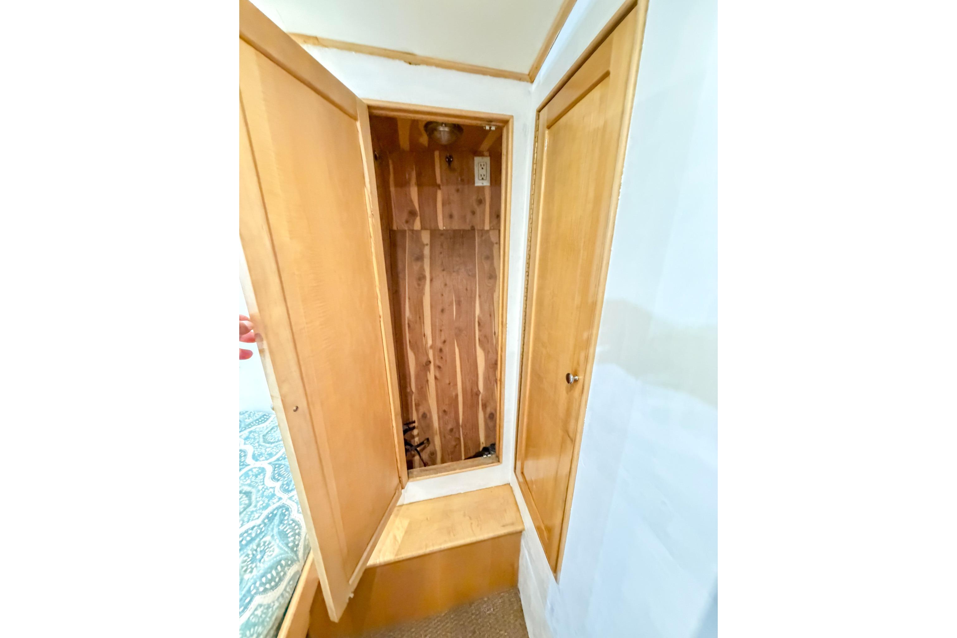 Interior view of 1998 Blackwell Custom Carolina Sportfish with wooden cabinetry and storage space.