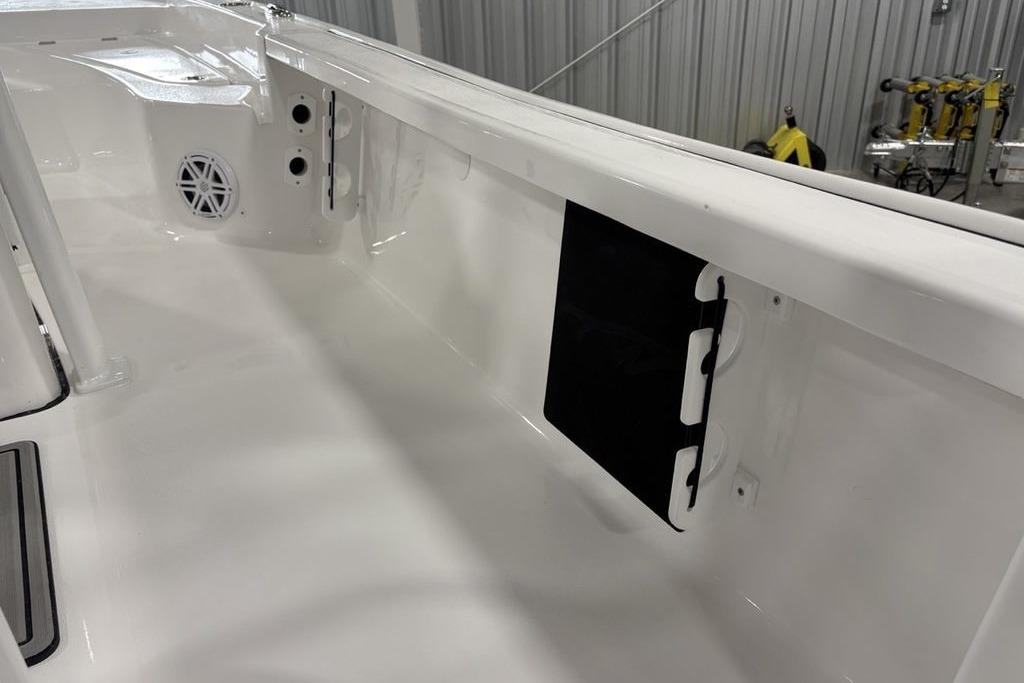 2026 Tidewater 2210 Carolina Bay boat interior with speaker and storage compartment.