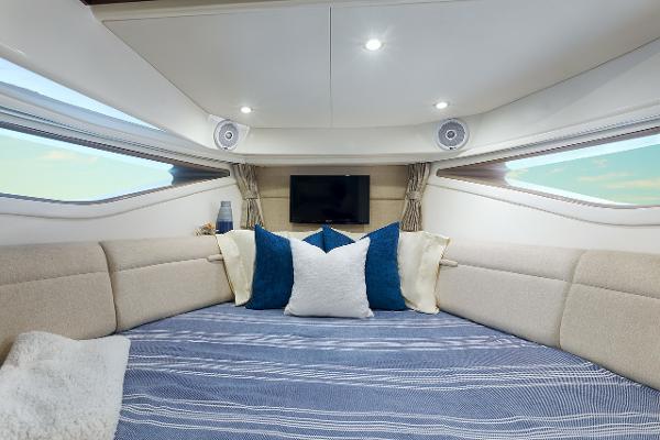 Manufacturer Provided Image: Luxurious interior of 2023 Sea Ray Sundancer 320 yacht with cozy bedding and modern amenities.