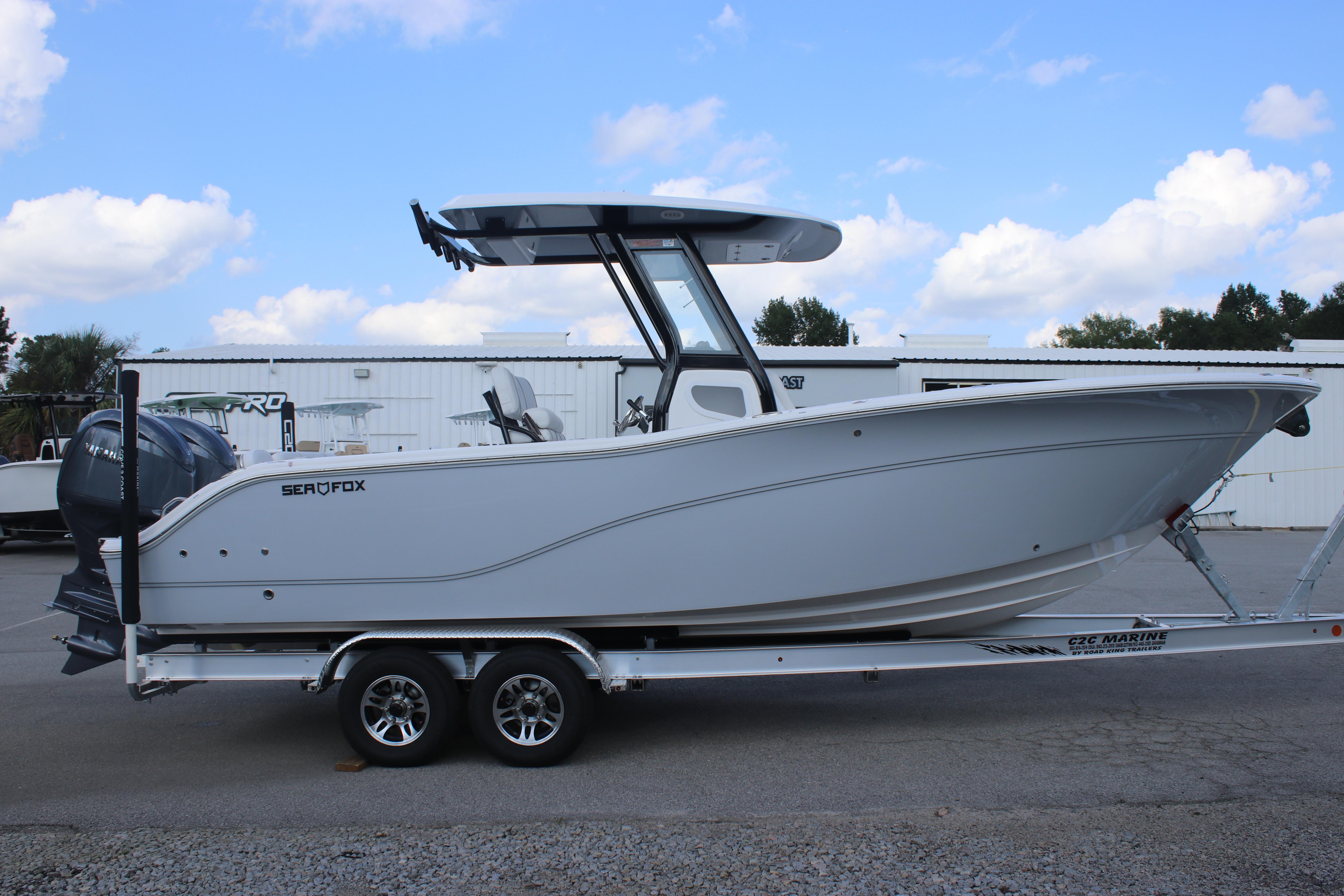 2026 Sea Fox 268 Commander boat on trailer, side view, outdoors.