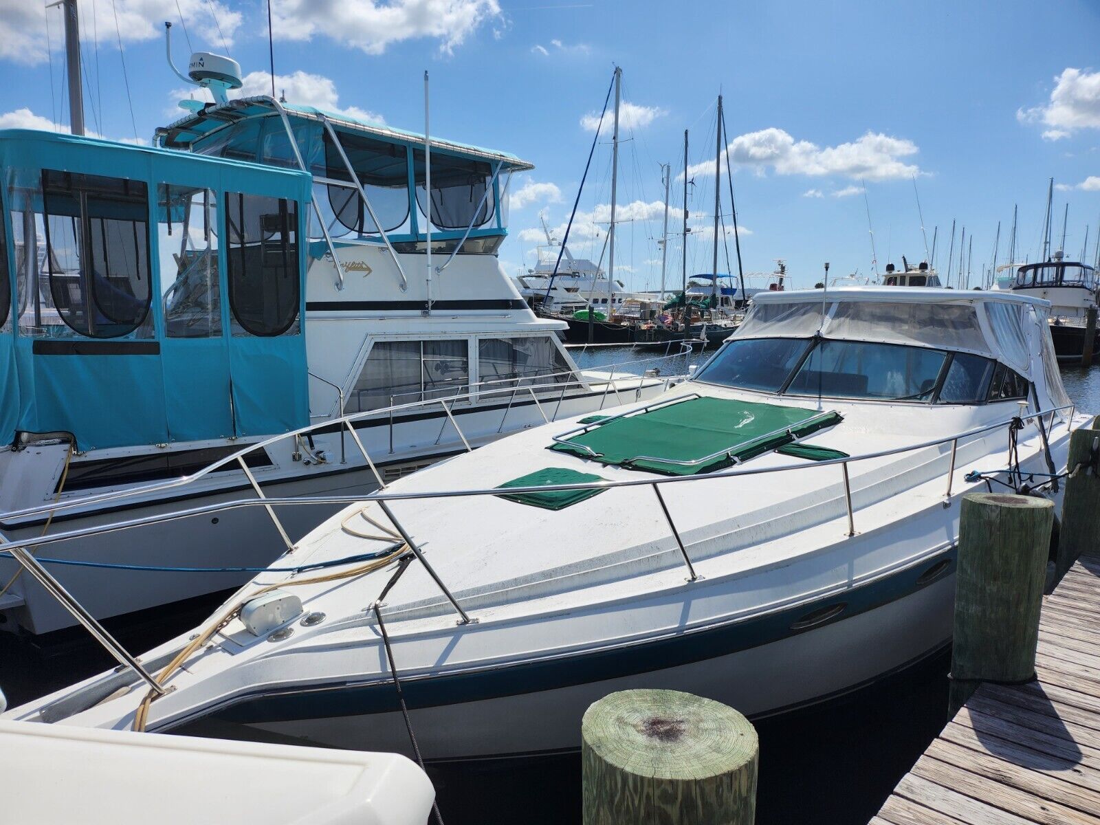 1988 Regal Commodore 360 yacht docked in sunny marina.