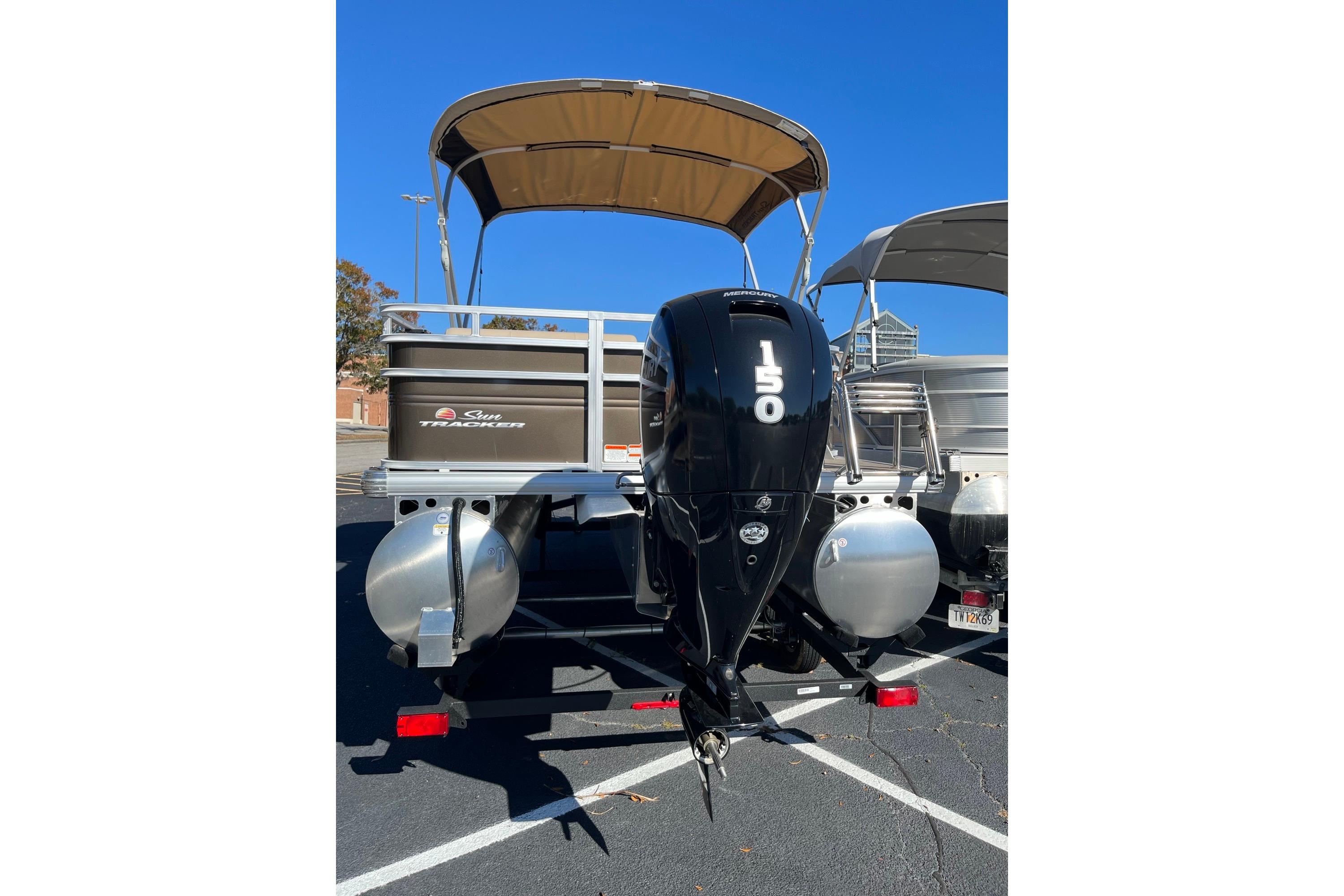 2025 Sun Tracker SportFish 22 DLX pontoon boat with Mercury 150 outboard motor.