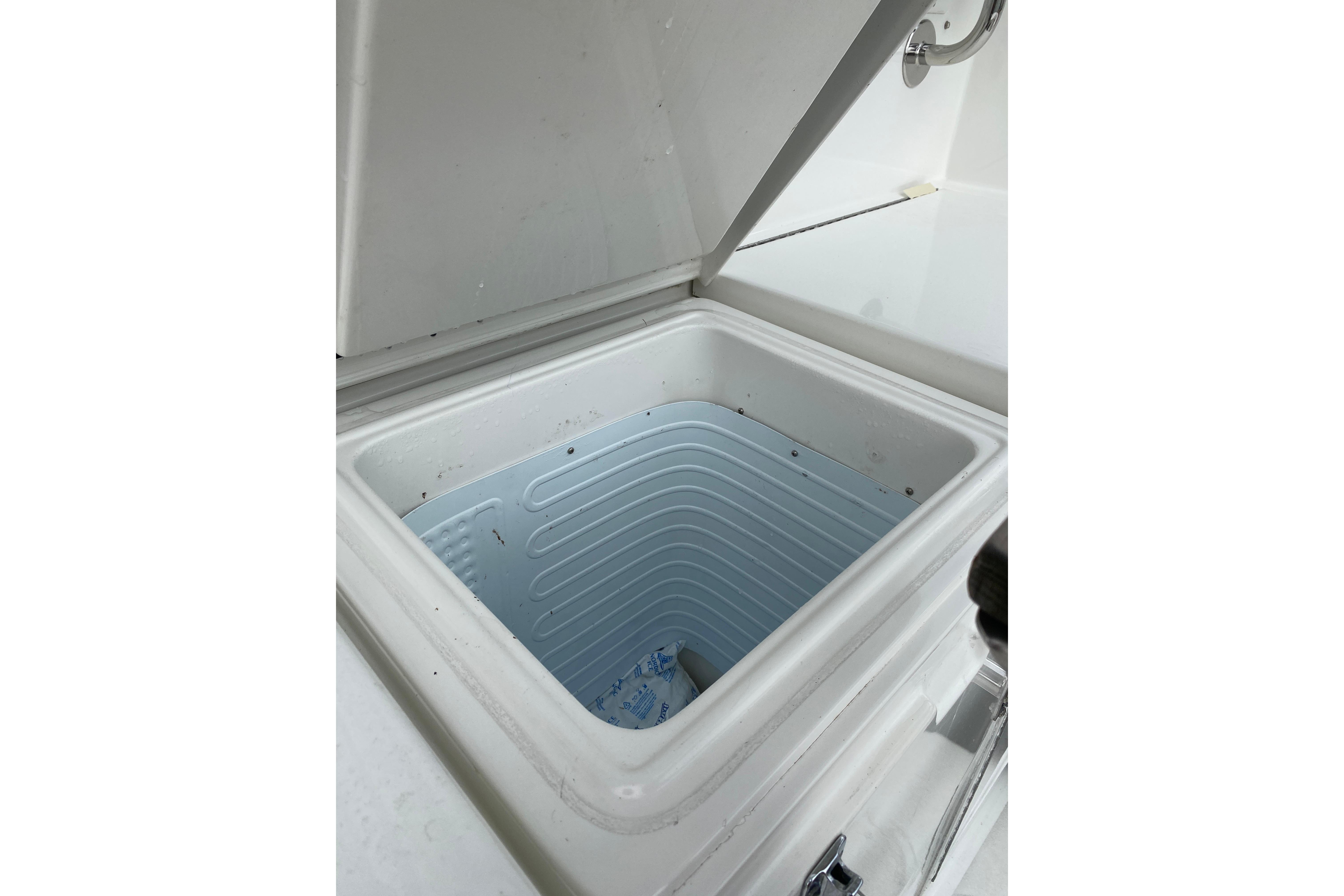 Open storage compartment on 1995 Hatteras 50 Convertible Sportfish boat.