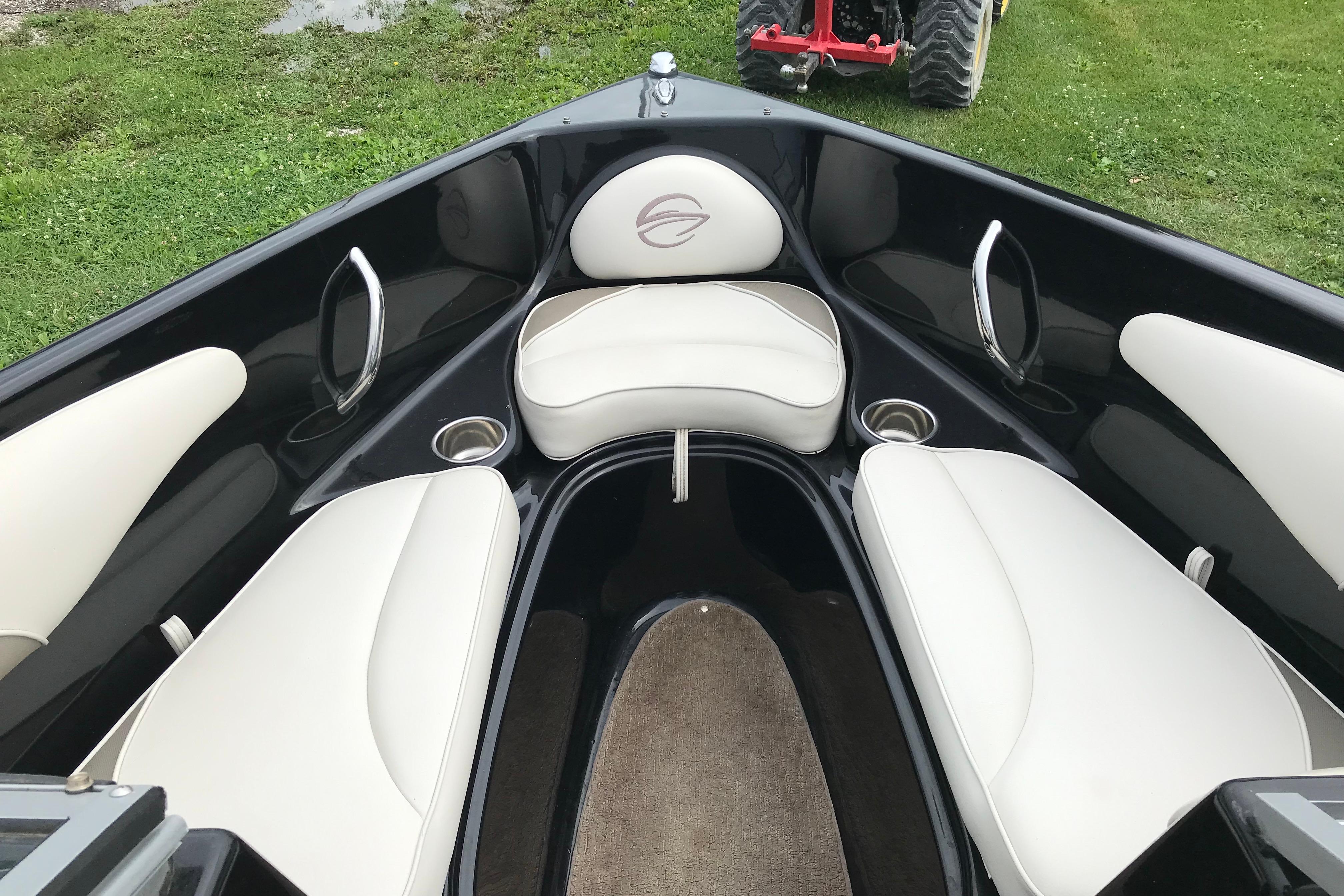 Interior of 2015 Crownline 18 SS boat with white seating and cup holders.