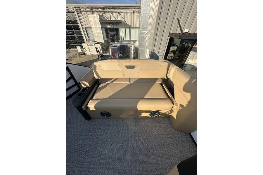 2026 Evotti 523CS boat interior with beige seating and cup holders.