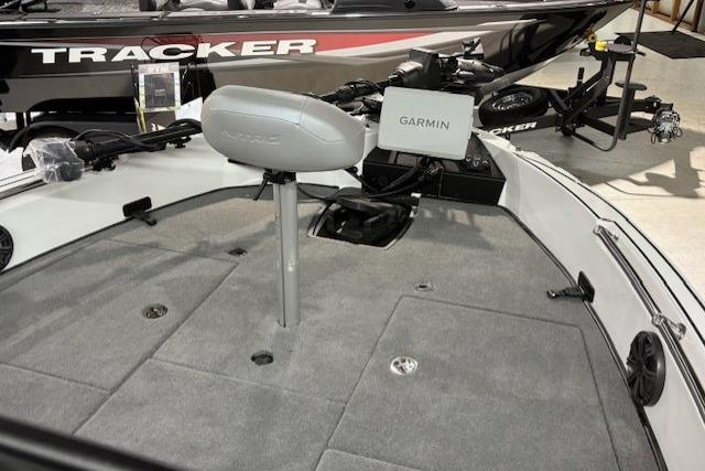 2026 Nitro ZV20 Sport Pro boat interior with Garmin system and Tracker boat in background.