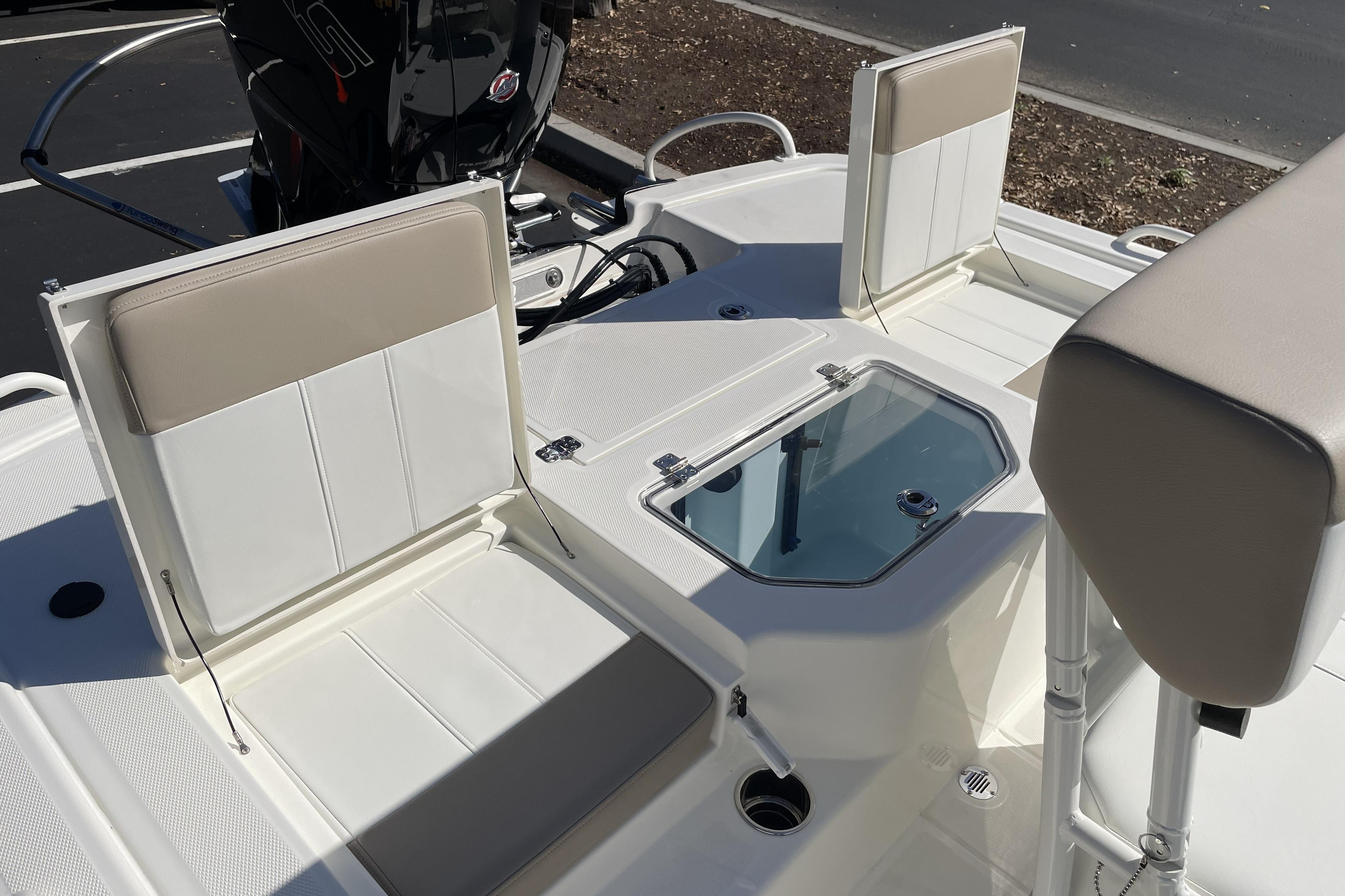 2026 Mako Pro Skiff 19 CC boat interior with seating and storage compartments.
