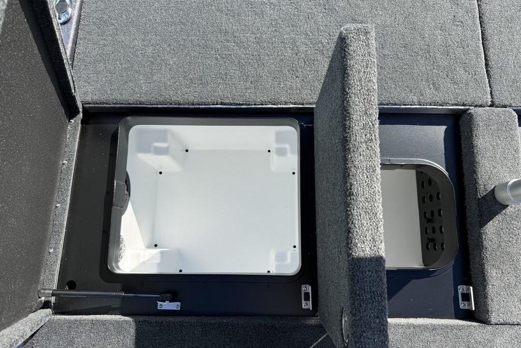 2026 Skeeter ZXE21 boat storage compartments with open lids, showcasing interior space.