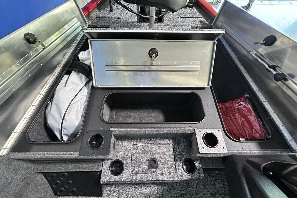 Interior of 2026 Tracker Pro Team 195 boat showing storage compartments and seating.