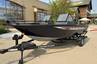 2026 Tracker Pro Guide V-175 WT boat on trailer, parked outdoors.