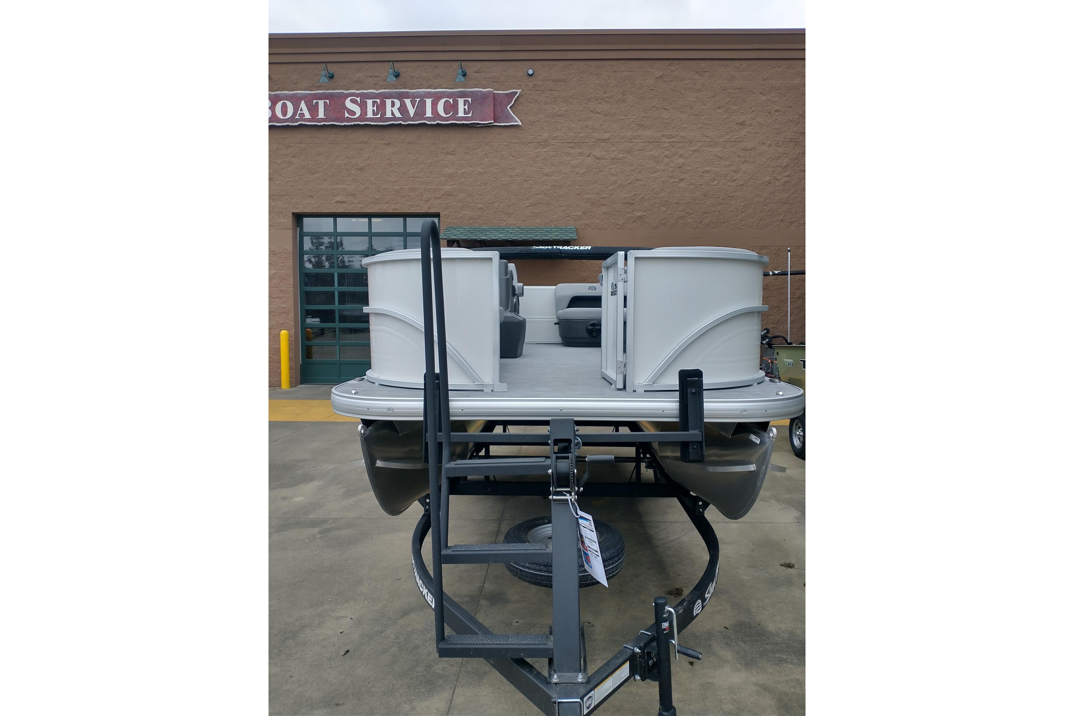 2026 Sun Tracker Party Barge 16 DLX pontoon boat at a service center.