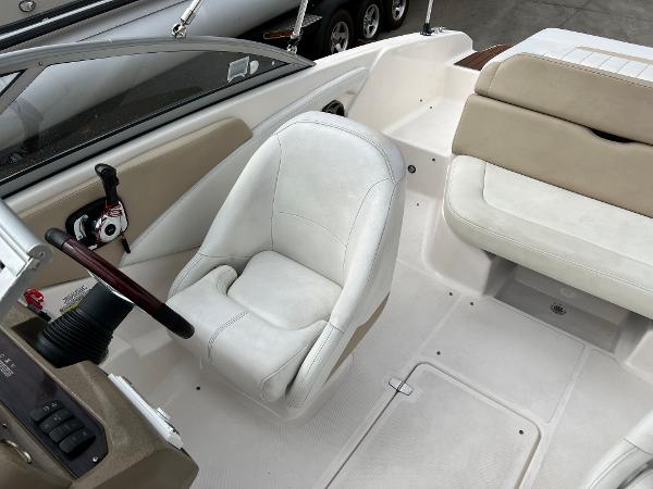 2013 Regal 1900 boat interior with white captain's chair and beige seating.