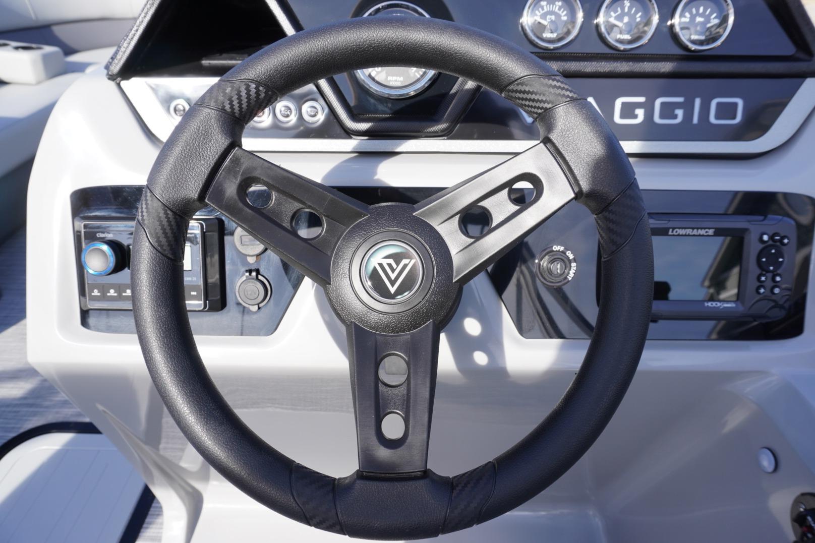 Steering wheel of 2026 Viaggio Lago V-R boat with dashboard controls.