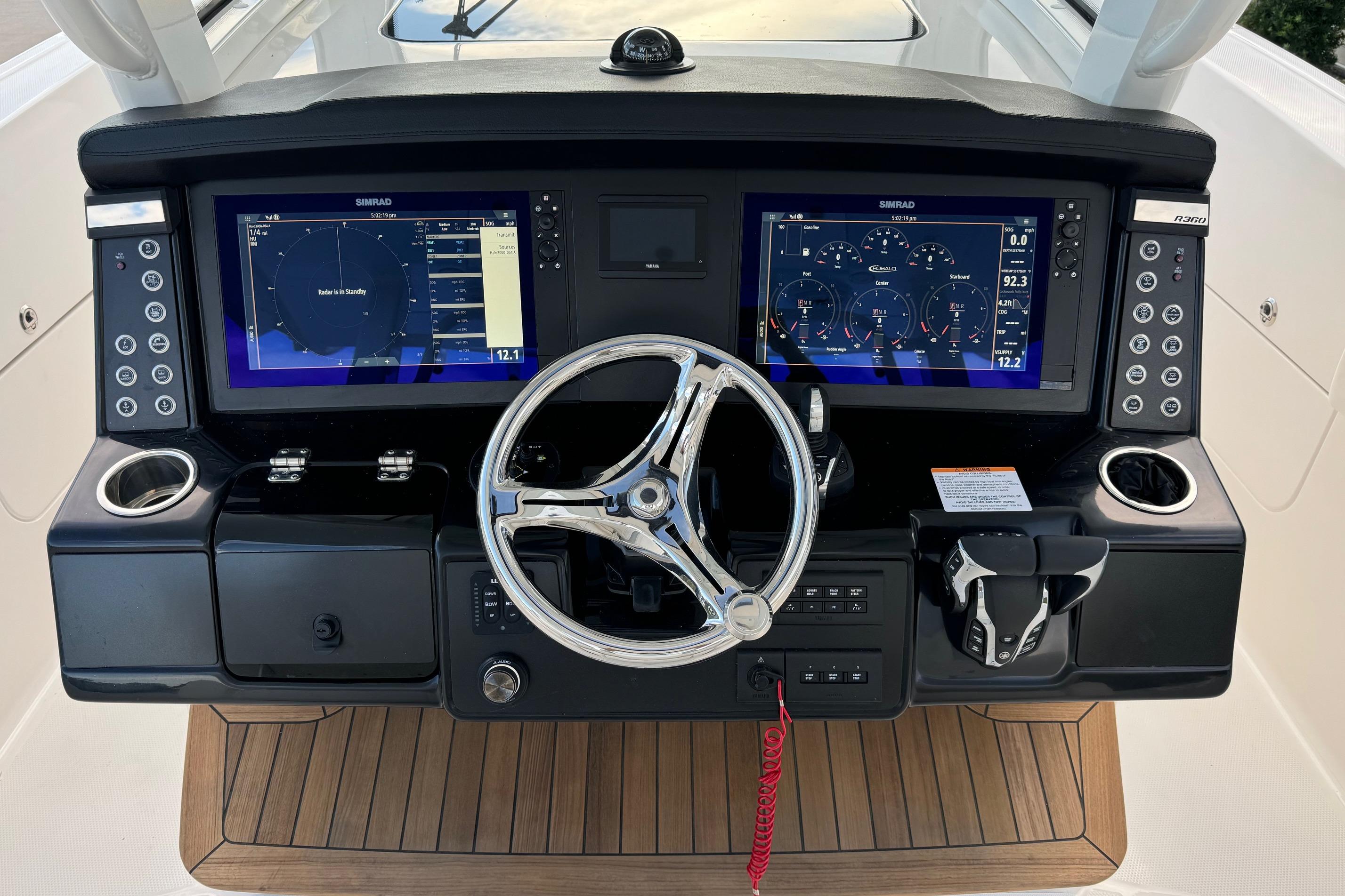 2025 Robalo R360 Center Console dashboard with dual Simrad displays and modern controls.