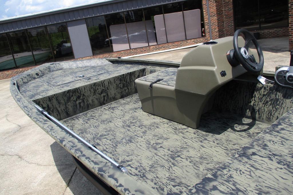2026 Tracker GRIZZLY® 1648 SC boat with camouflage design and steering console.